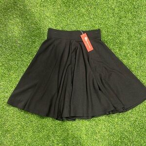 Black knit skater skirt with elastic waist.